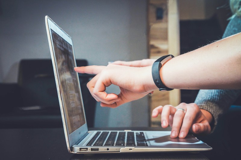 Person navigating a digital experience on a laptop